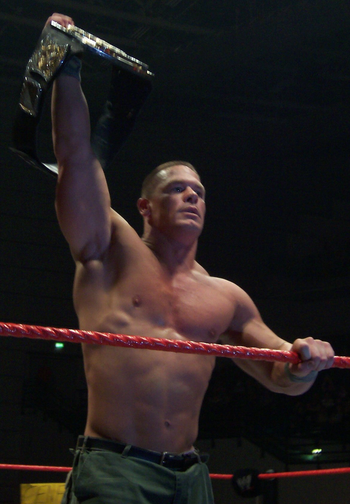 John Cena holding the WWE Championship during his championship years